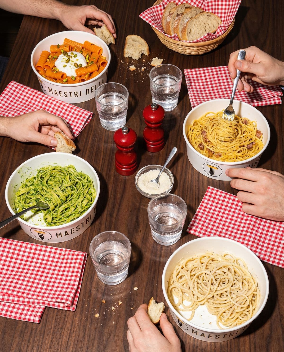 Friends sharing fresh pasta dishes at Maestri della Pasta